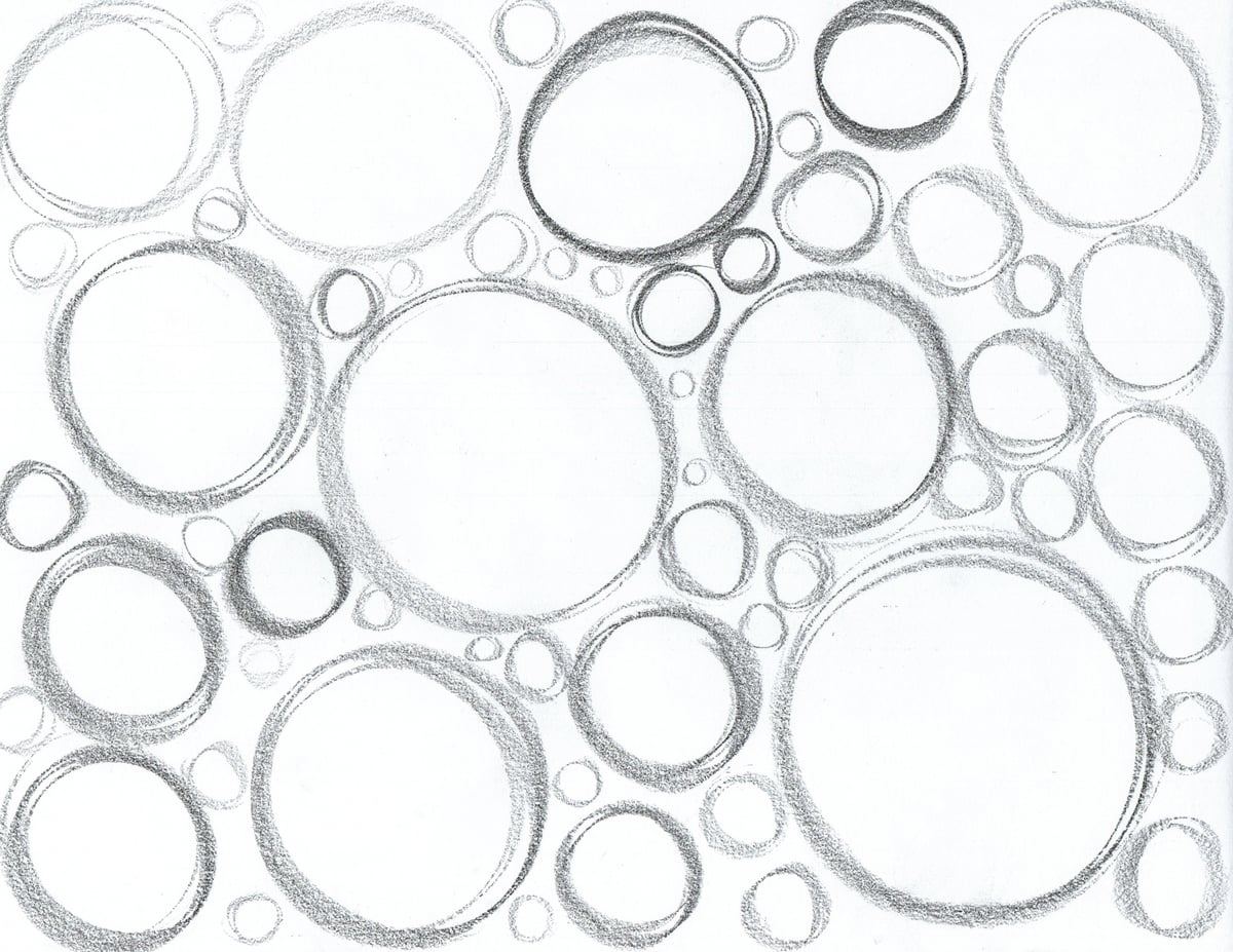 Pencil circles of different sizes filling a page, with light and dark overlapping strokes.